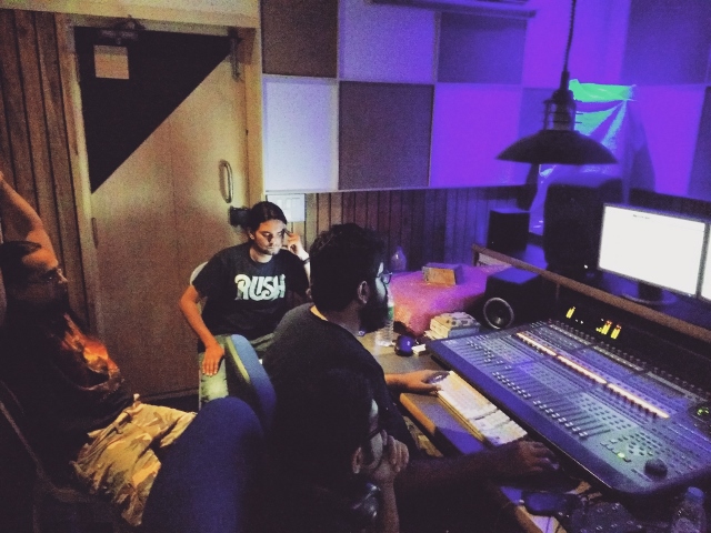 (from left) Drummer Anthony Hoover, bassist Ganesh Krishnaswamy and sound engineer Varun Taneja go over the mixes. Photo: Courtesy of Adarsh Recording Studios