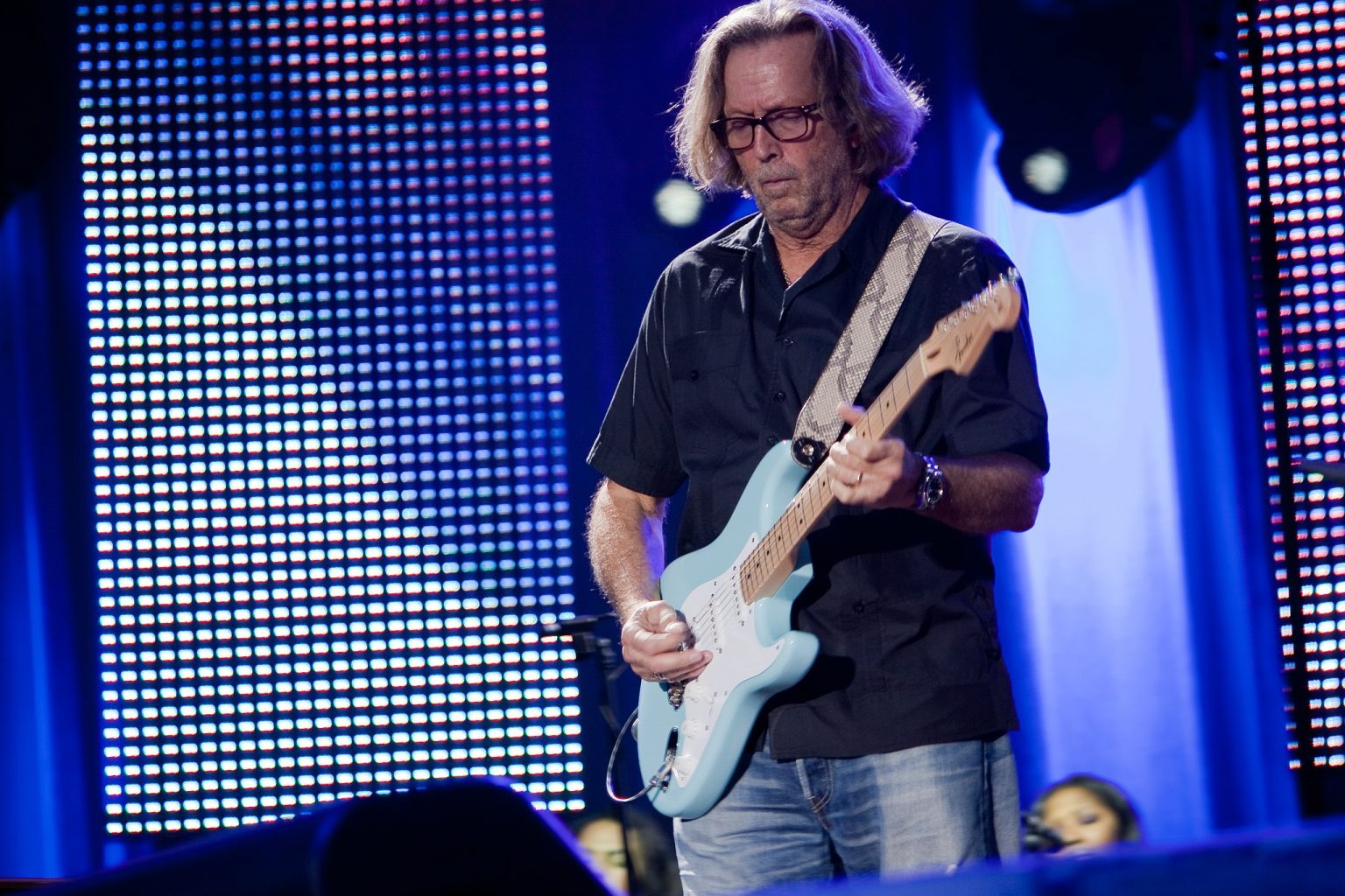 Eric_Clapton_in_concert Majvdl, CC BYSA 3.0 via Wikimedia Commons