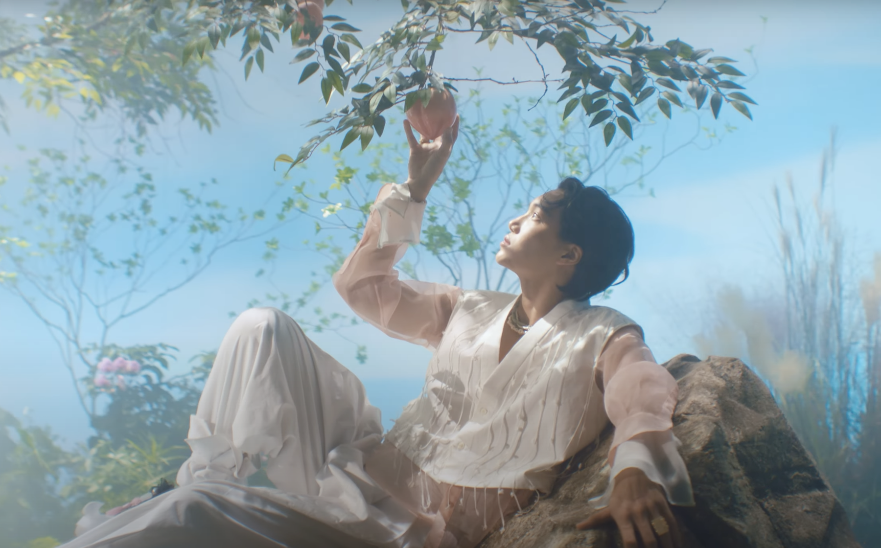 Watch: EXO's Kai Finds Paradise In Soft MV For “Peaches” Solo