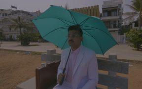 Agaahi Raahi aka Farhan Ahmed in Pondicherry holding umbrella