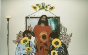 New Delhi/Goa band Begum posing with sunflower artwork