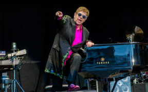 Elton John at the piano in concert