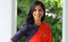 Sushma Soma in a red and blue sari