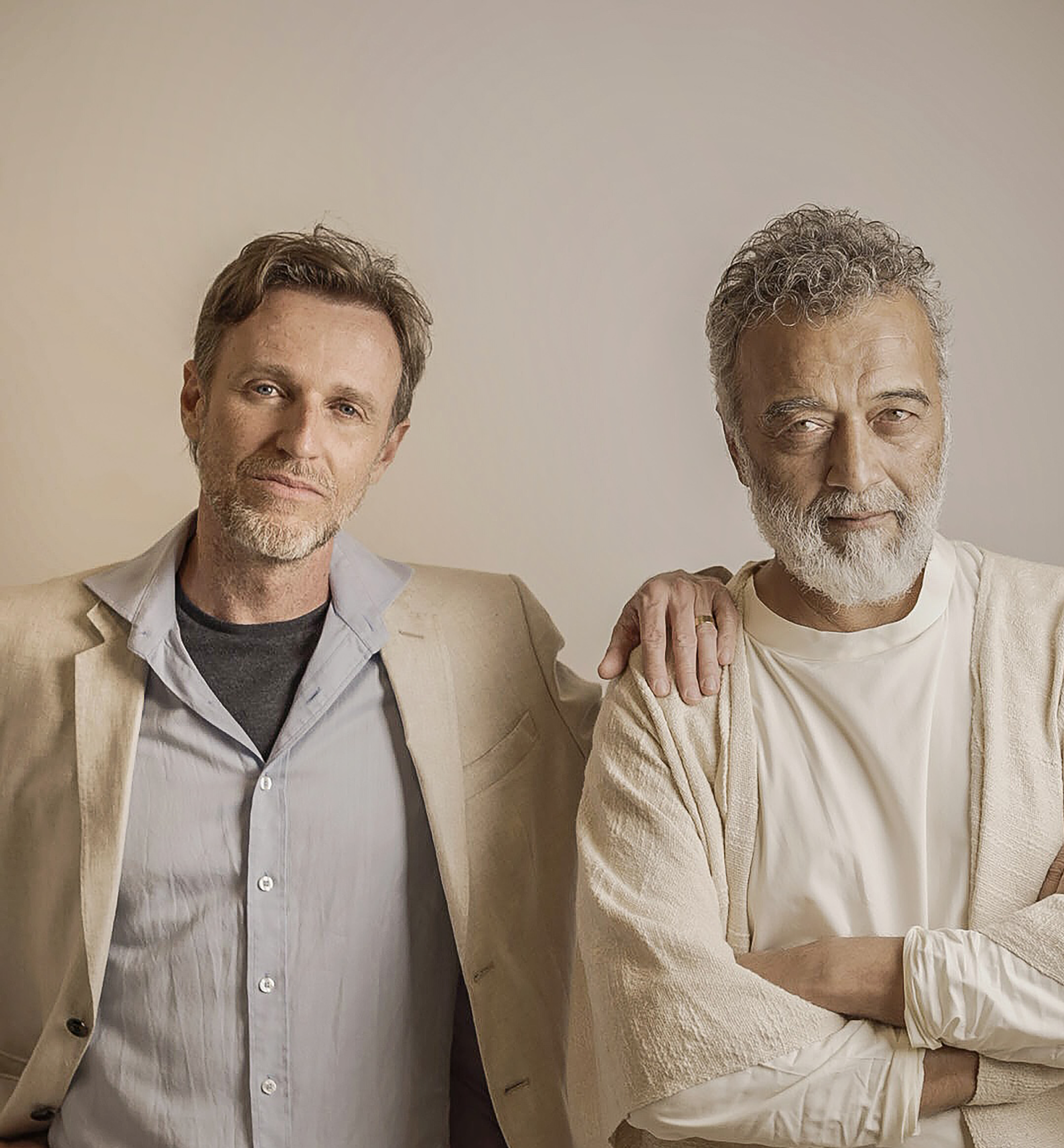 Mikey McCleary standing with a hand on Lucky Ali