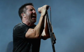 Trent Reznor of Nine Inch Nails sings into the mic