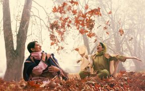 Actors Gauri Batra and Salonie Patel throwing leaves in a forest
