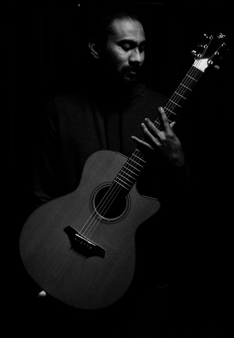 Akram Ul Haq with acoustic guitar