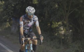 Shantanu Moitra in biking gear riding bicycle