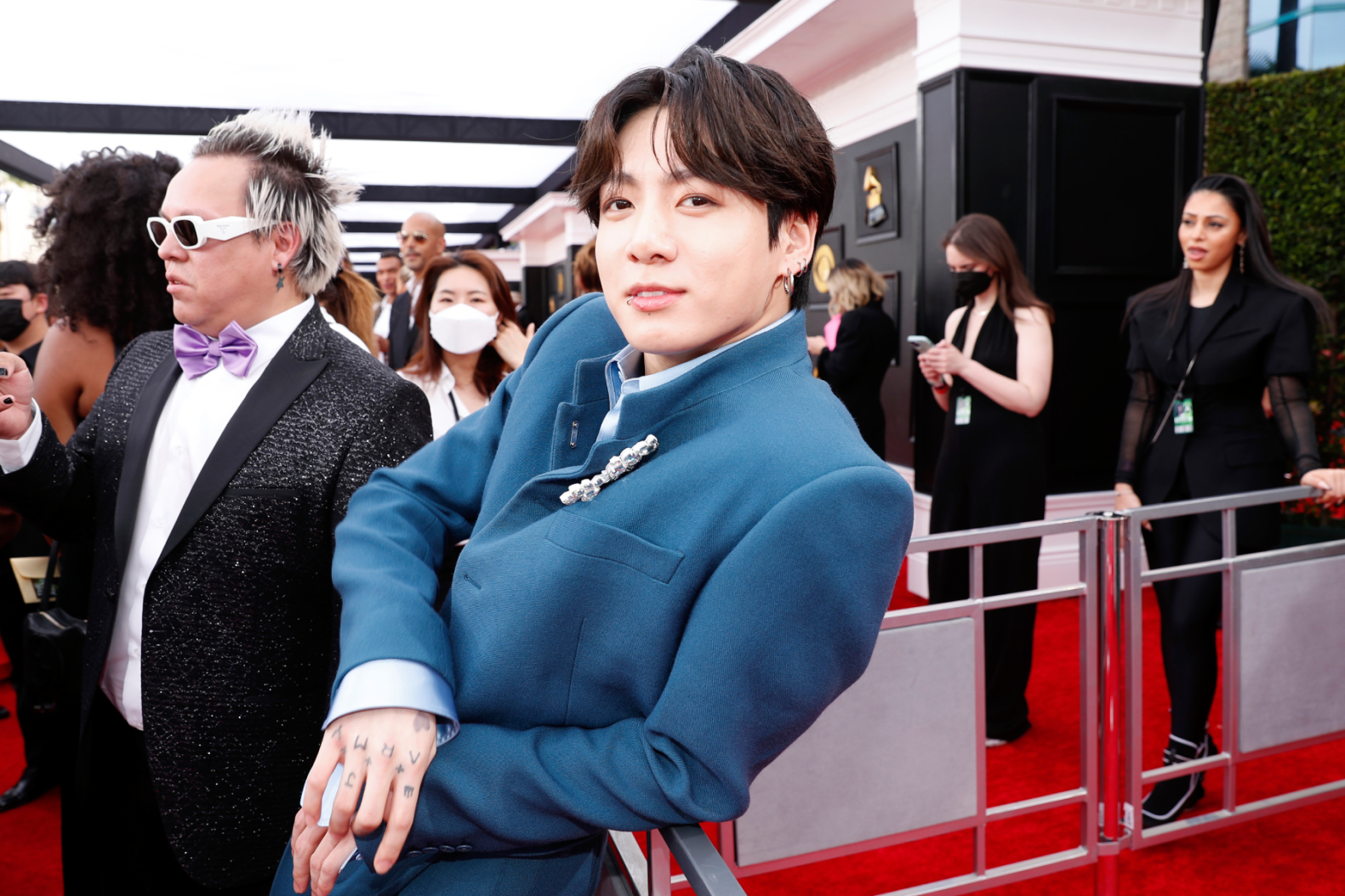 Jin, Jungkook, and RM of BTS attend the 64th Annual GRAMMY Awards