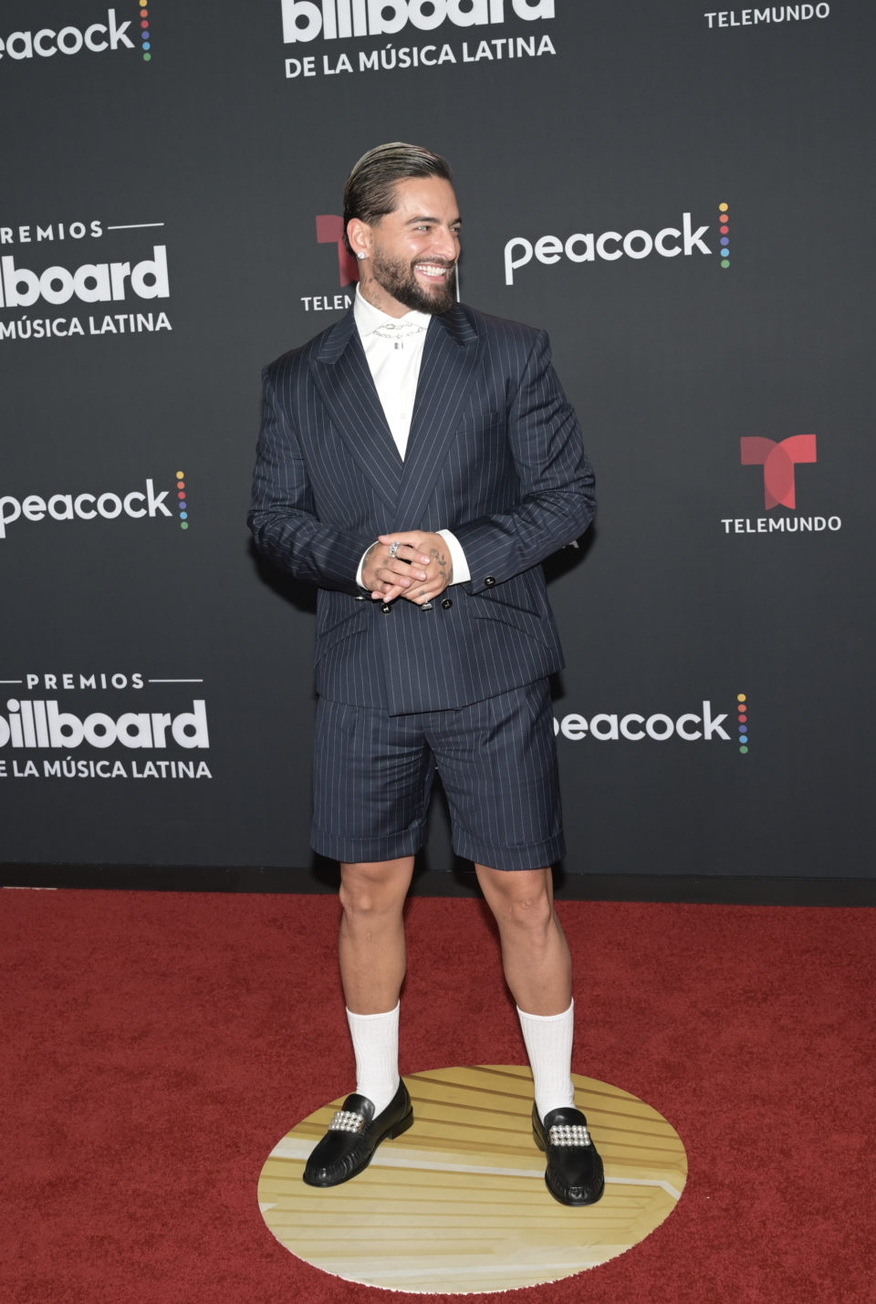 Maluma dressed in a suit and shorts by Gaurav Gupta on the red carpet