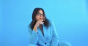 Singer-songwriter Natania Lalwani in a bright blue suit