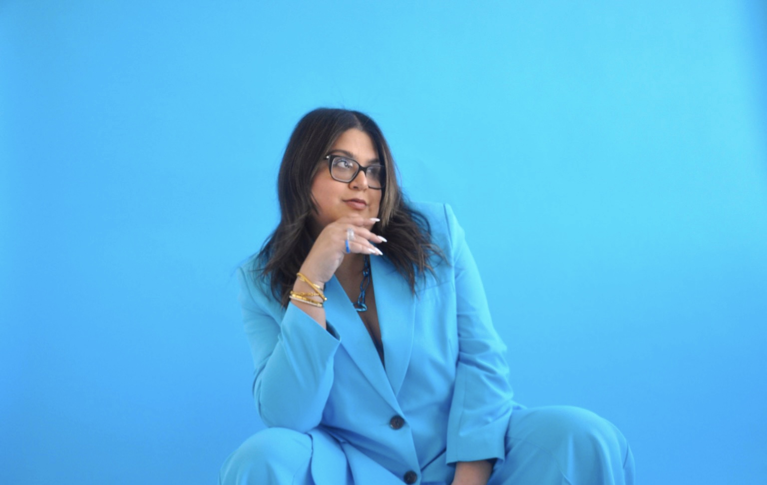 Singer-songwriter Natania Lalwani in a bright blue suit