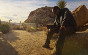Mumbai-bred musician Sanjay Maroo sitting in Joshua Tree National Park in California for his music video Holding On