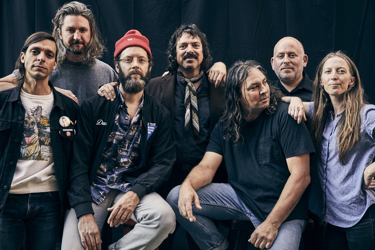 Seven band members of American indie rock act The War On Drugs, including Adam Granduciel, pose for a photo