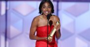 Ayo Edebiri in a red dress accepts Golden Globe award for The Bear