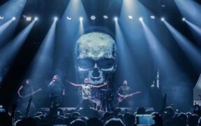 Indian folk metal band Bloodywood onstage in front of a crowd