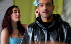 Jonita and Ali Sethi in blue and black outfits in the video for Love like That