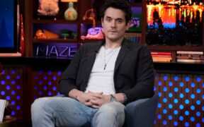 John Mayer seated on the Andy Cohen show Watch What Happens Live