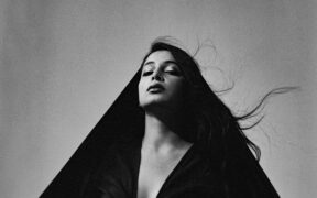 Indo-American artist Sheherazaad wearing a black dress