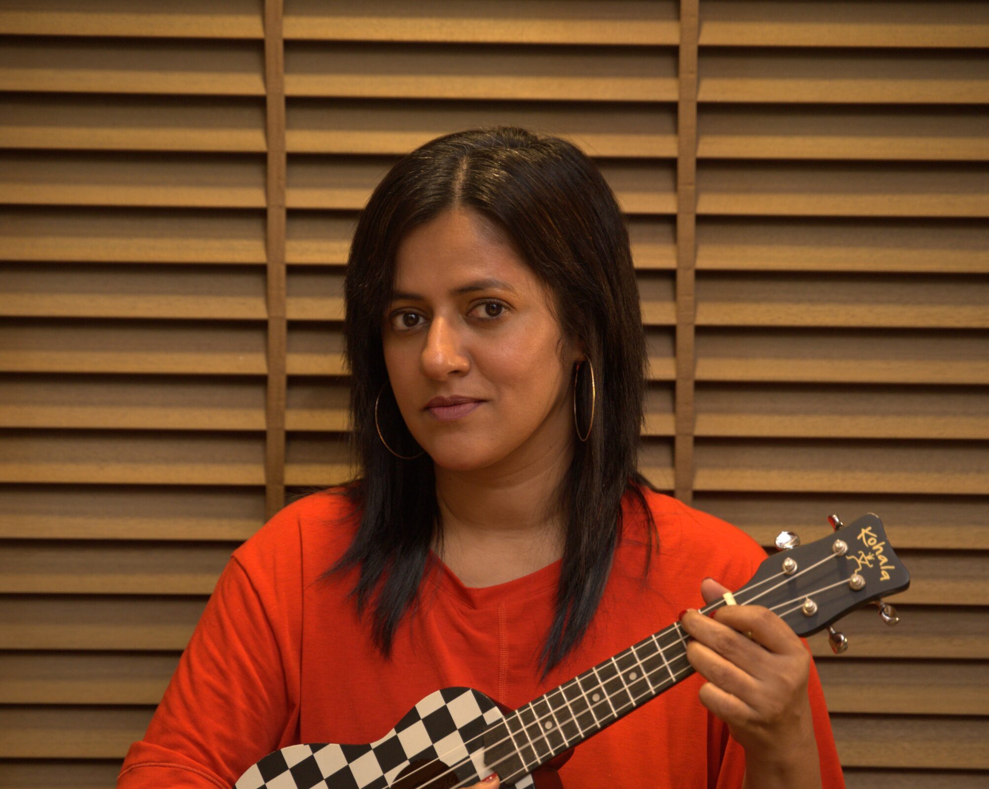 Composer-producer Sneha Khanwalkar with a ukulele in her hand