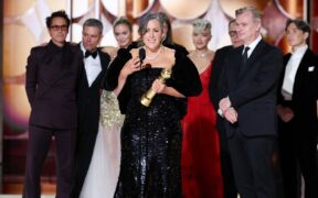 The cast and crew of Oppenheimer accept the Best Picture, Drama award at the Golden Globes 2024