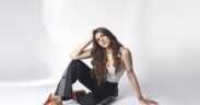 Ananya Birla in black pants and white top posing for photo