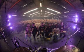 Project Mishram band members pose for a photo with the crowd at music festival UK Tech Fest