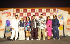 Artists pose for a photo on stage for Royal Stag BoomBox songs and festival