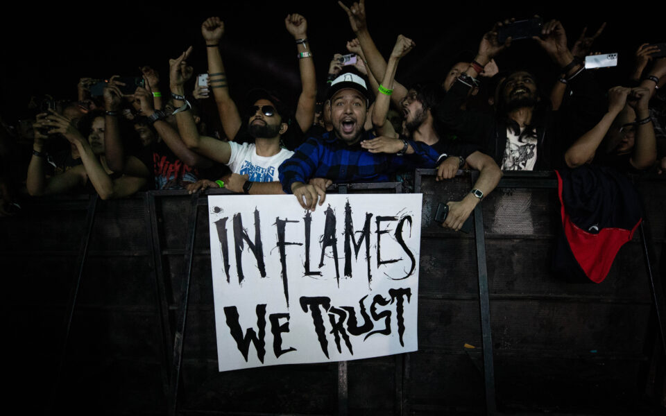 Fans holding a sign that reads In Flames We Trust at Bangalore Open Air festival