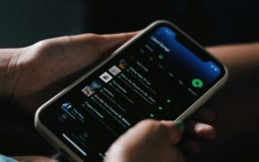 Person streaming Spotify on his phone