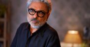 Director and composer Sanjay Leela Bhansali in a black shirt and black glasses