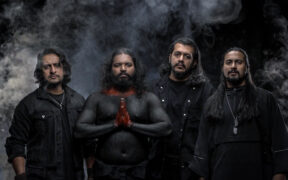 Mumbai metal band members Zygnema wearing all black with smoke in the background