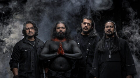Mumbai metal band members Zygnema wearing all black with smoke in the background