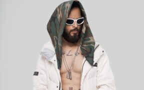 Mumbai hip-hop artist Shaikhspeare wearing white jacket and black hood bandana