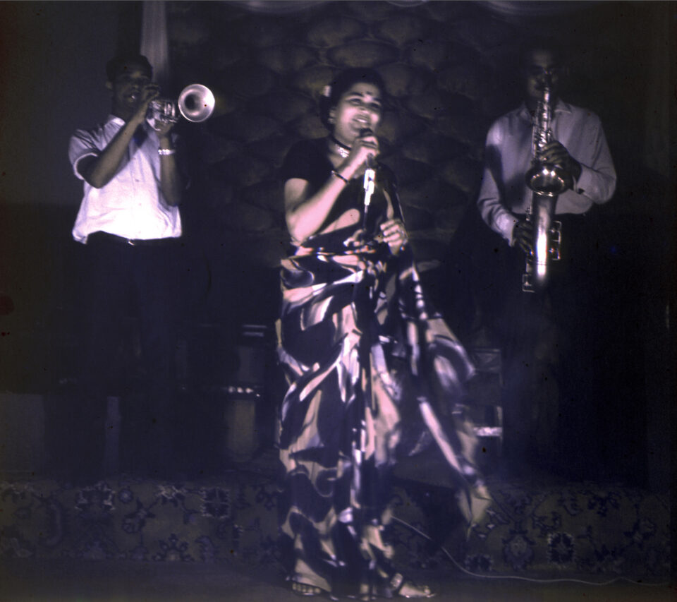 Singer Usha Uthup performing in a saree at Trincas. with her band