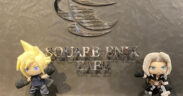 Figurines of Final Fantasy characters Cloud and Sephiroth at the Square Enix cafe sign