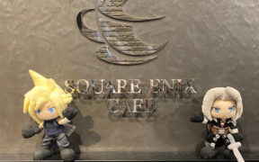 Figurines of Final Fantasy characters Cloud and Sephiroth at the Square Enix cafe sign