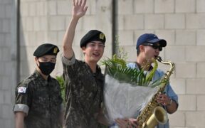 BTS member Jin with RM and Jimin outside a military base in Yeoncheon, South Korea.