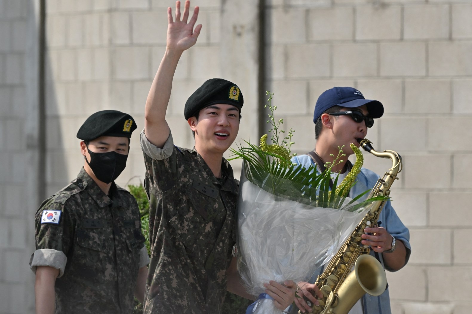 BTS member Jin with RM and Jimin outside a military base in Yeoncheon, South Korea.