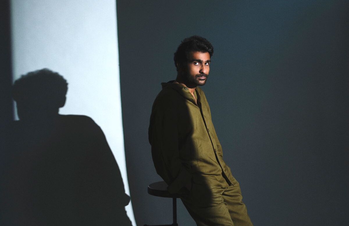 Prateek Kuhad in an olive green outfit with shadow