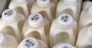 Bottles of raw milk are displayed for sale at a store in Temecula