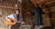 Jatin and Wings plating guitar with a vocalist singing in background