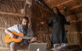 Jatin and Wings plating guitar with a vocalist singing in background