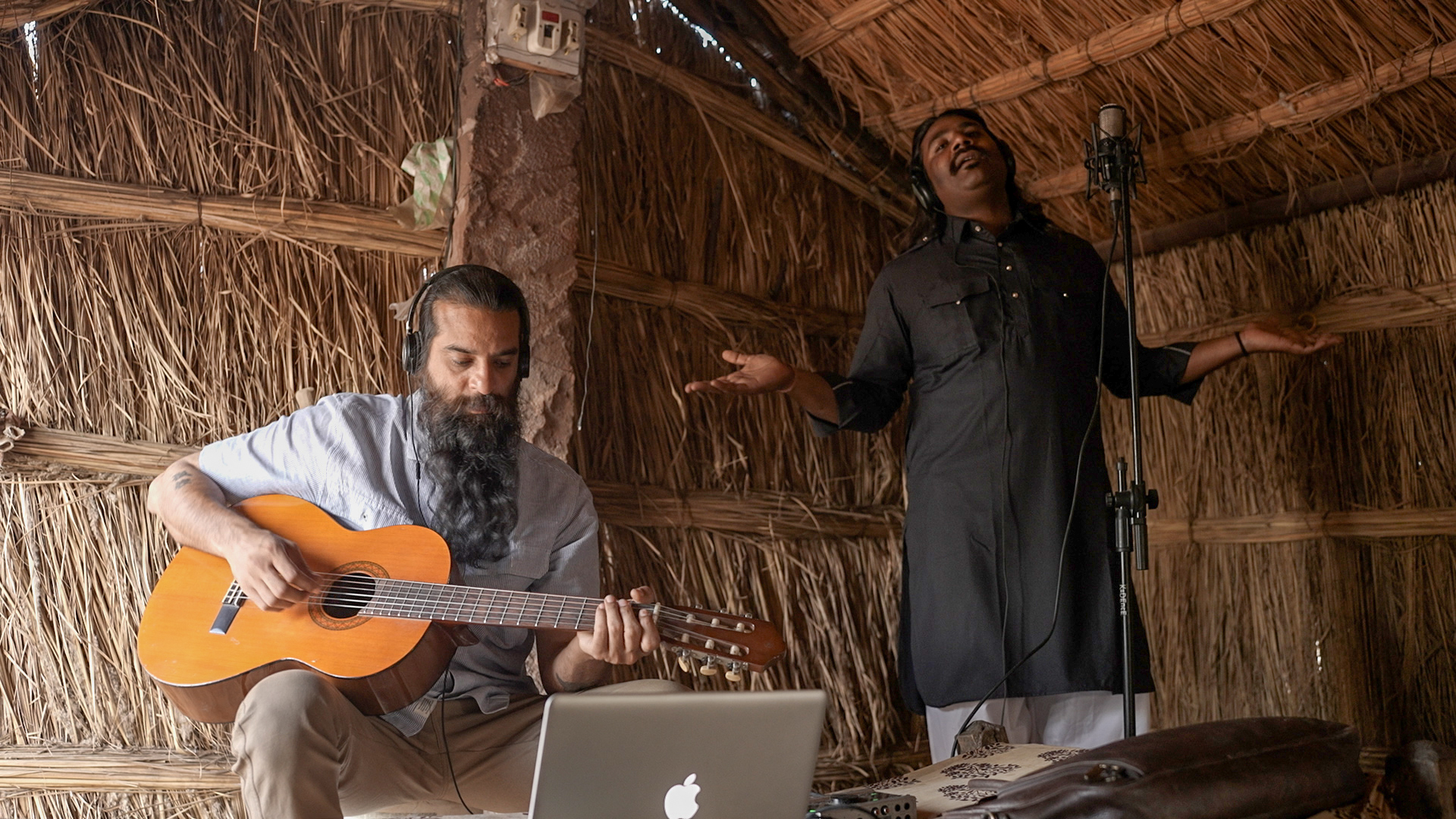 Jatin and Wings plating guitar with a vocalist singing in background