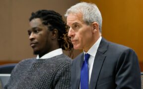 Young Thug and his lawyer, Brian Steel, watch Judge Ural Glanville speak during the hearing of key witness Kenneth Copeland