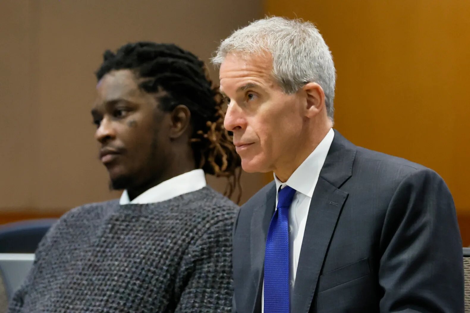 Young Thug and his lawyer, Brian Steel, watch Judge Ural Glanville speak during the hearing of key witness Kenneth Copeland