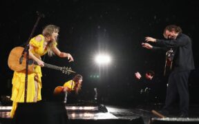 Taylor Swift and Aaron Dessner of the National perform onstage for night three of Taylor Swift | The Eras Tour at Nissan Stadium in Nashville, Tennessee