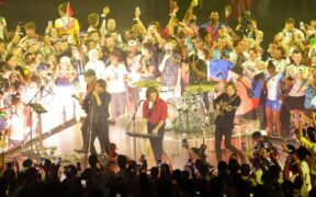 Athletes invade the stage as Phoenix perform during the closing ceremony of the 2024 Paris Olympic Games