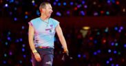 Chris Martin performs on stage during a concert at the Ernst Happel Stadium in Vienna, Austria