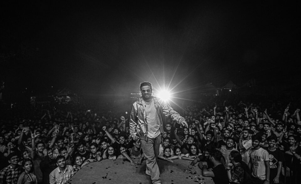 Neeraj Madhav performing with a crowd 